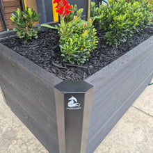 Load image into Gallery viewer, Close-up of the Mr Fox heavy-duty powder-coated steel corner bracket used in composite timber sleeper raised garden beds.