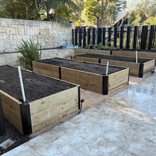 Load image into Gallery viewer, Raised garden bed assembled with steel sleeper corner brackets from Mr Fox in a Box